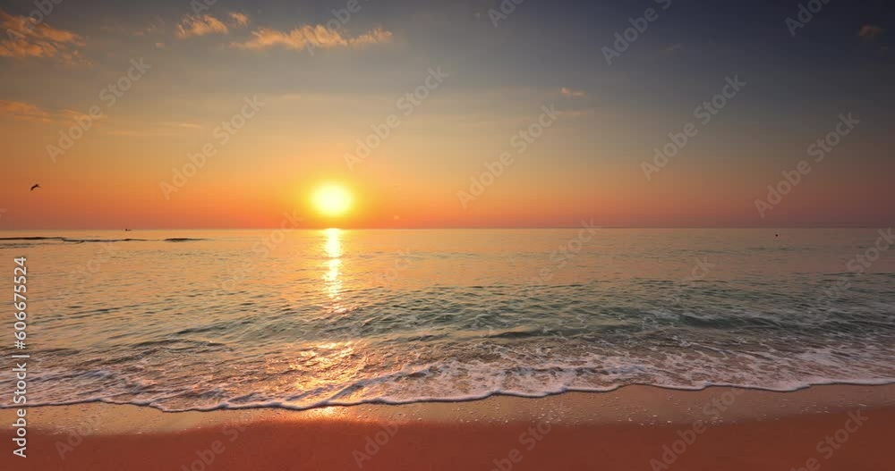 Tropical beach shore and golden sea sunrise and splashing sea waves Tropical beach shore and golden sea sunrise and splashing sea waves