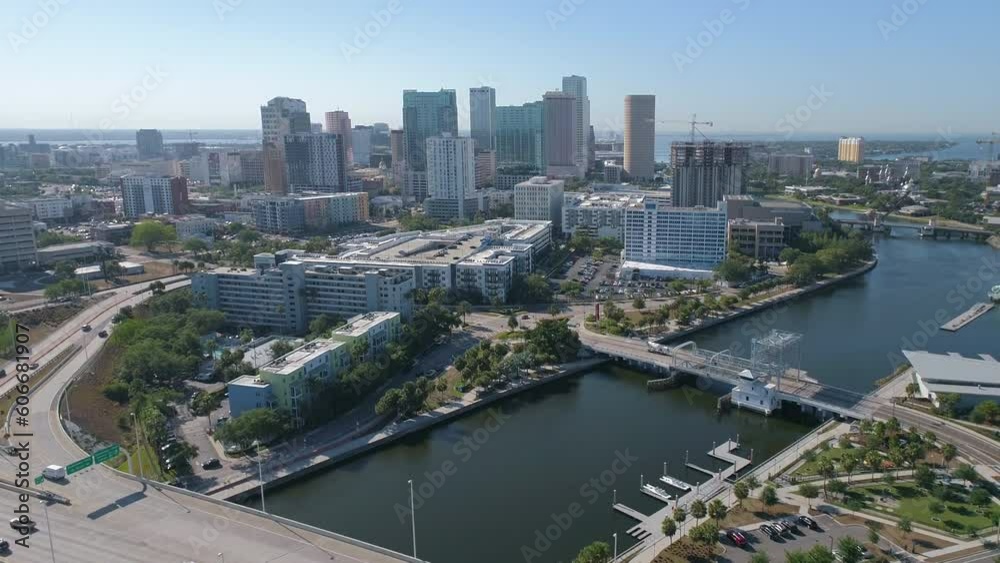 Aerial drone shot of Downtown Tampa skyline pulling away and ascending to reveal skyline and vista during morning traffic Aerial drone shot of Downtown Tampa skyline pulling away and ascending to reveal skyline and vista during morning traffic