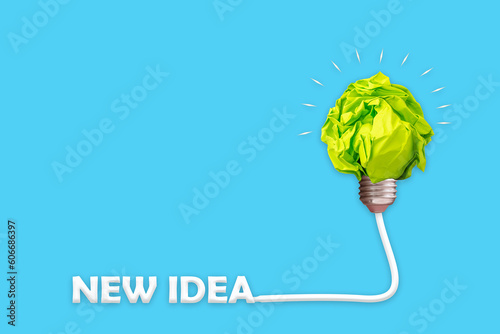 New Idea. Crumpled paper light bulb. Isolated on a blue background. The concept of inspiration, new ideas. Business.