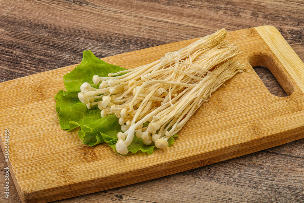 Raw Enoki mushrooms for cooking Raw Enoki mushrooms for cooking