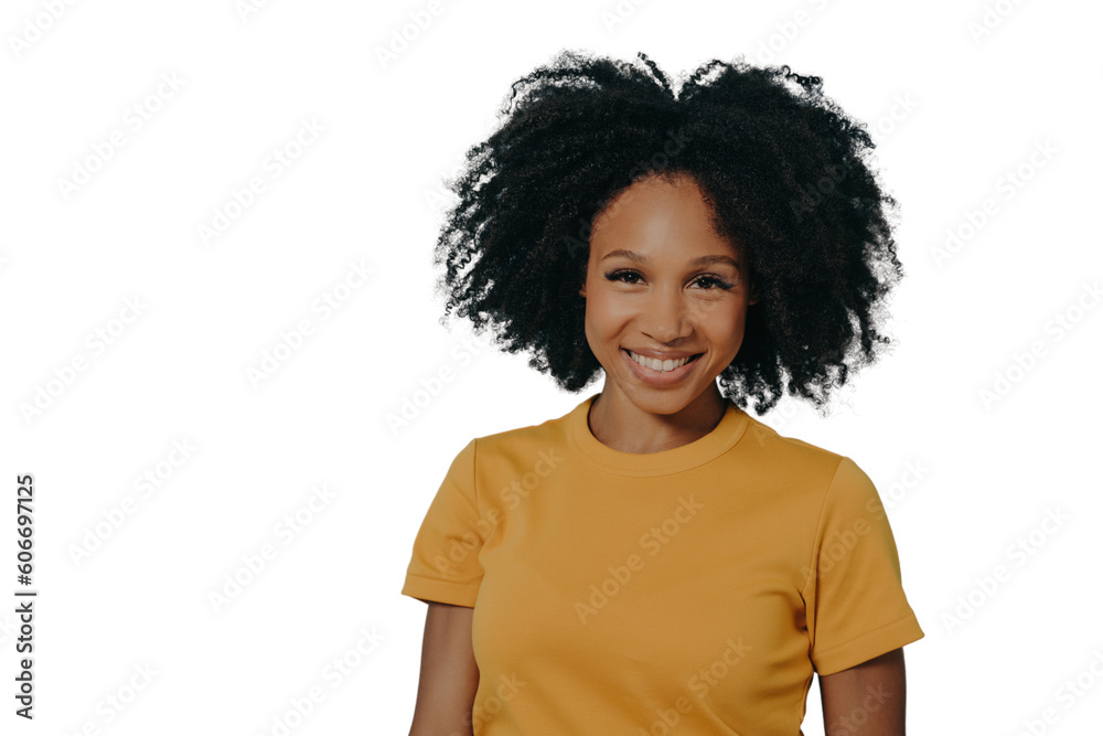 Happy dark skinned woman smiling at camera with pleased face expression, isolated on blue background