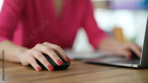 Hand of businesswoman working at computer using mouse closeup. Work online concept
