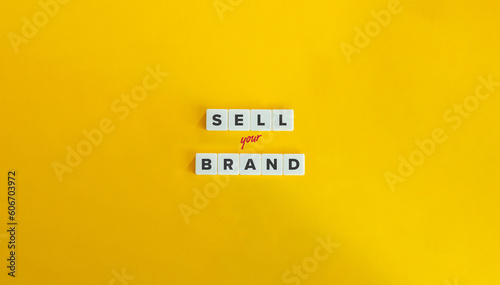 Sell Your Brand Phrase. Branding, Selling Strategy, Brand Awareness, Promotion, and Marketing Concept. Block Letter Tiles on Yellow Background. Minimal Aesthetic.