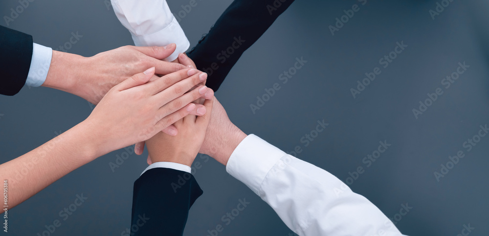 Top view partial hands wearing formal suit joining stack and form ...
