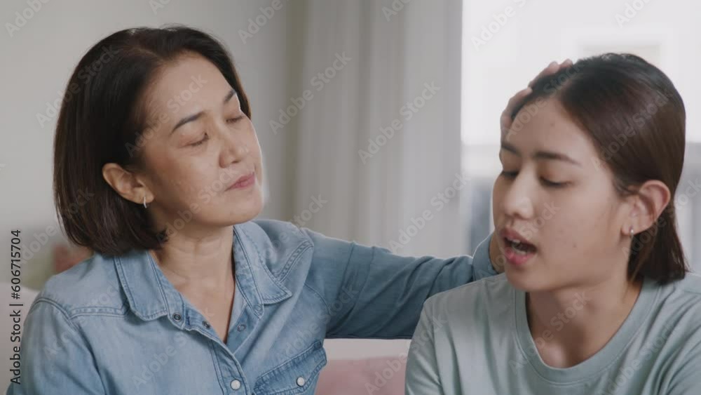 Middle aged asia people old mom love care trust comfort help young teen talk crying stress relief at home. Mum as friend listen adult child woman feel pain sad worry of broken heart life crisis issues Middle aged asia people old mom love care trust comfort help young teen talk crying stress relief at home. Mum as friend listen adult child woman feel pain sad worry of broken heart life crisis issues