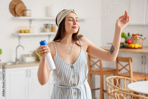 Young woman with air freshe...