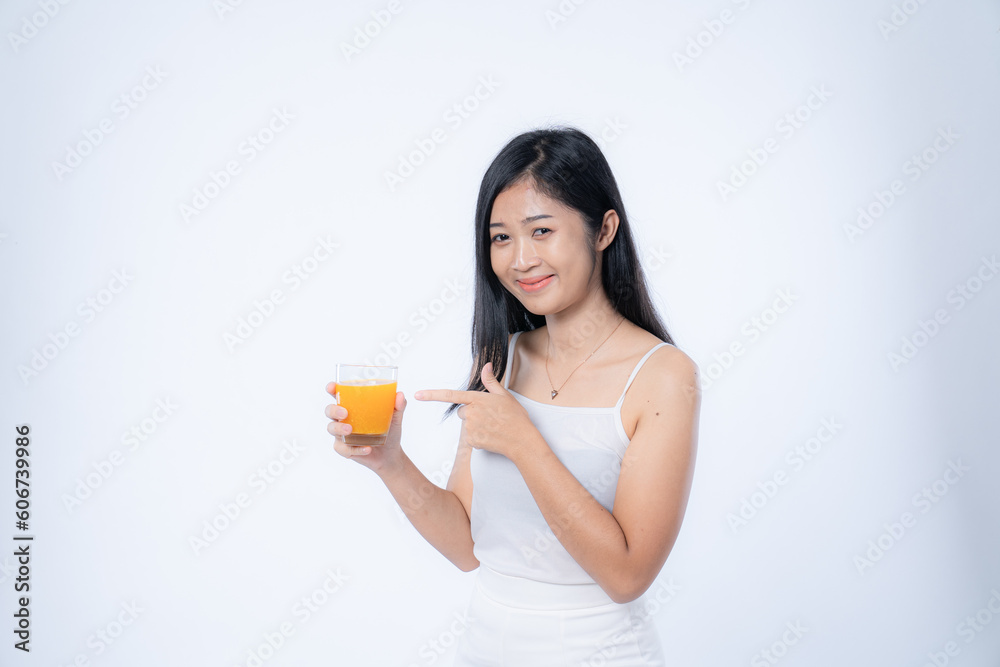 woman with a glass of orange juice, isolated on white woman with a glass of orange juice, isolated on white