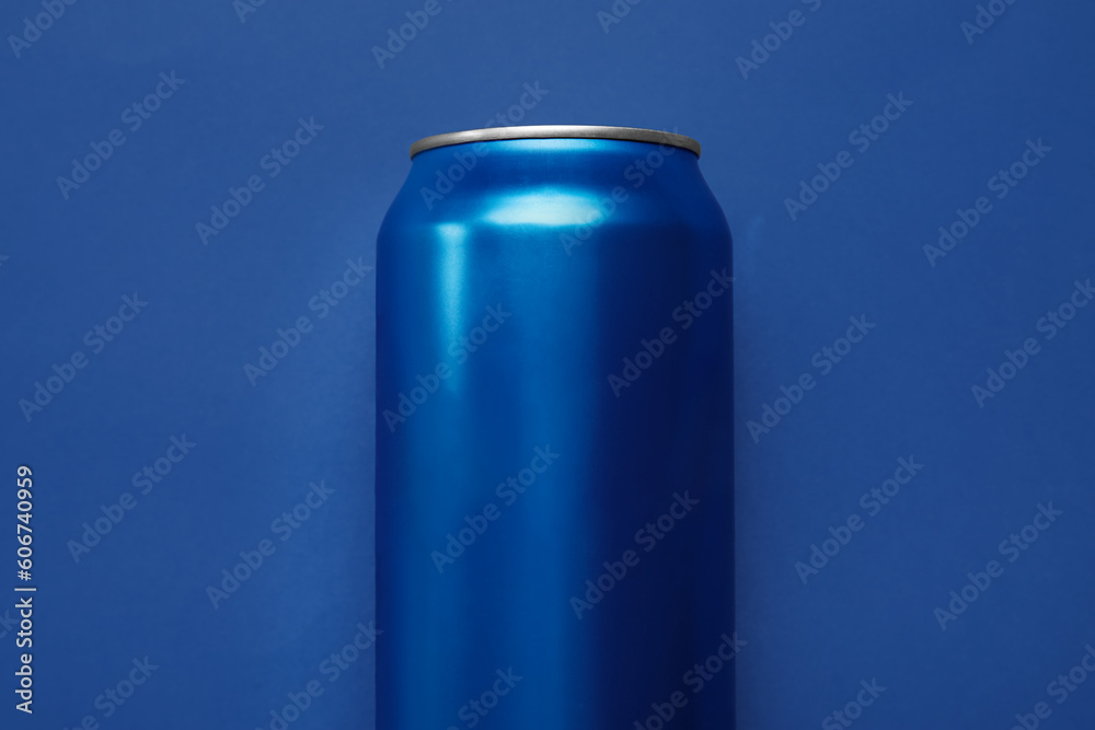Can of soda on blue background, closeup Can of soda on blue background, closeup