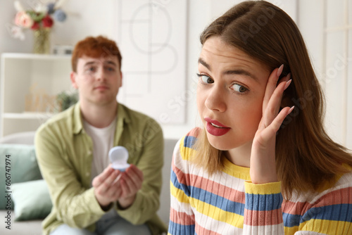 Confused young woman get proposed at home, closeup