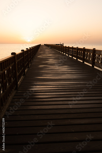 Wooden pier in the sunset, red sea