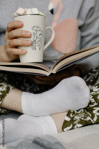 marshmallow in mug and reading book 