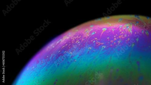 Macro shot of a colorful soap bubble on the black background