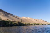 Beautiful landscape of Nile river near the desert on a sunny morning