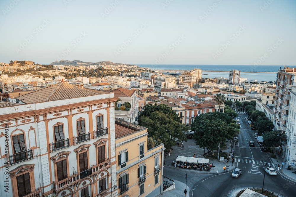 Aerial view of cityscape and Palazzo Valdes and blue sea on the horizon in Cagliari, Italy