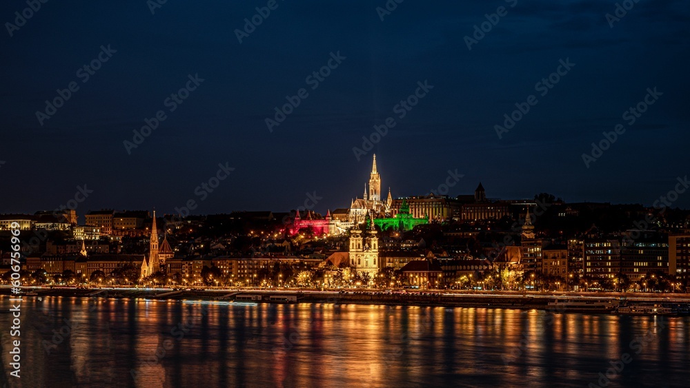 View of the illuminated skyline of Budapest, Hungary at the night reflected in waters