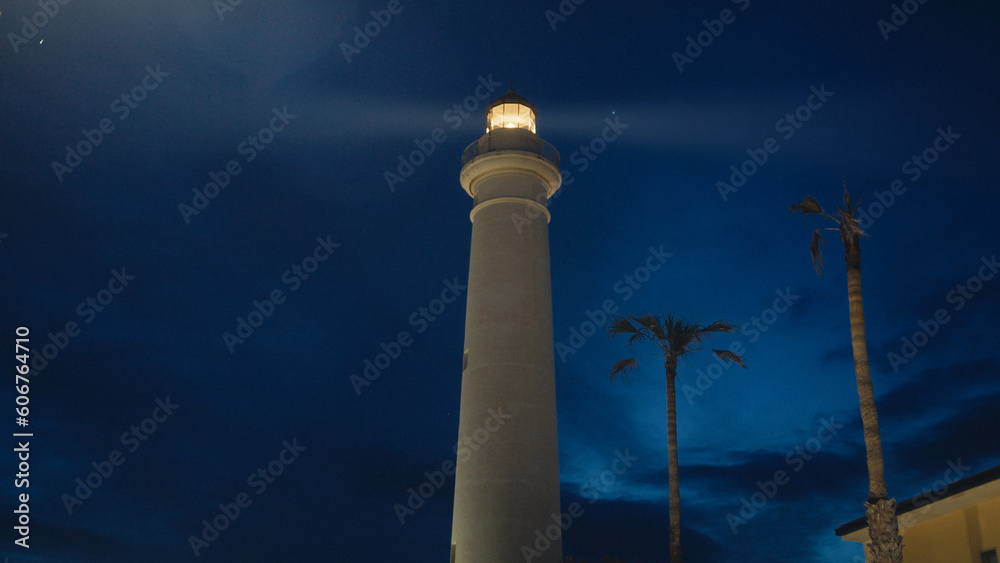Lighthouse tower in the night with beam light Lighthouse tower in the night with beam light