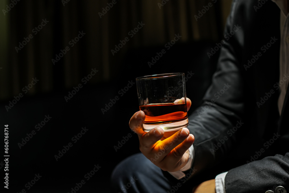 businessmen holding a glass of whiskey businessmen holding a glass of whiskey