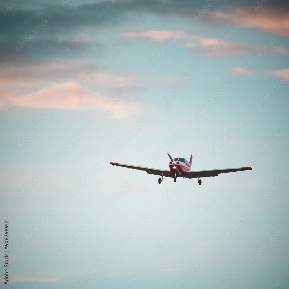 Closeup of M20K aircraft flying in the sky at sunset Closeup of M20K aircraft flying in the sky at sunset