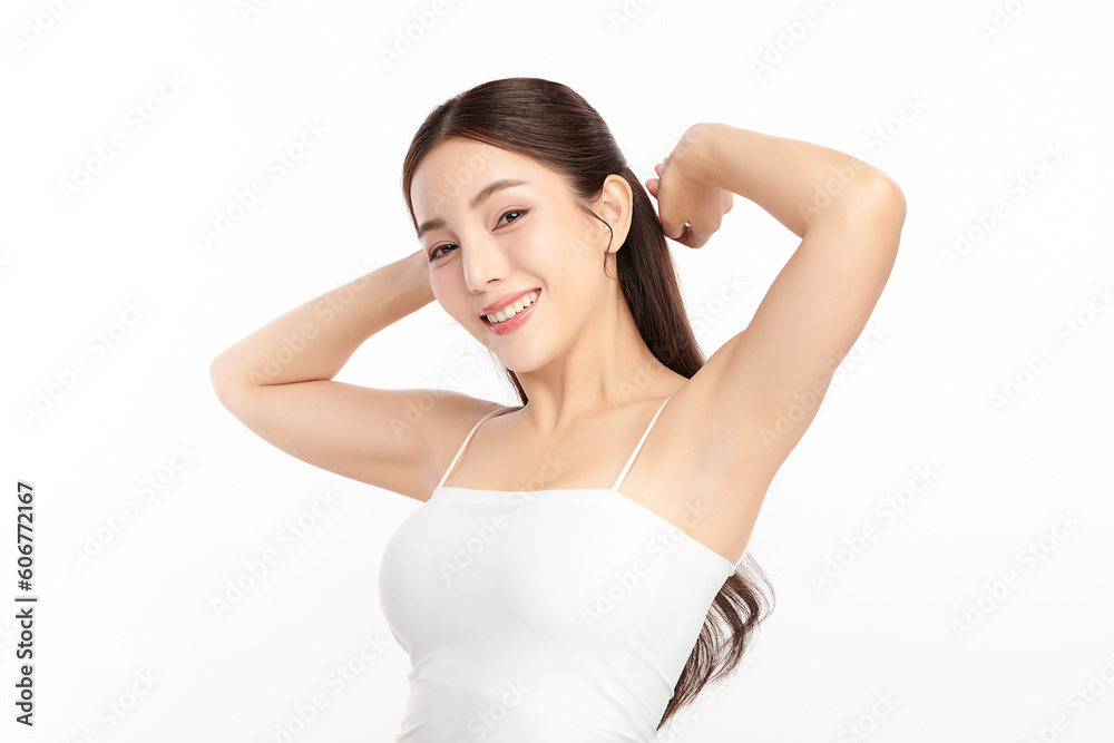 Beautiful Young Asian woman lifting hands up to show off clean and hygienic armpits or underarms on white background, Smooth armpit cleanliness and protection concept Beautiful Young Asian woman lifting hands up to show off clean and hygienic armpits or underarms on white background, Smooth armpit cleanliness and protection concept