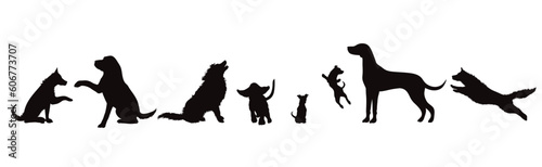 Set of vector silhouette of different dogs on white background.