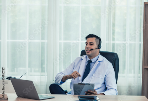 Physician conducts online, distant consultations via video call. Taking medical histories, dealing with patient's concerns, answering queries. Creating a treatment plan and prescribing medications.