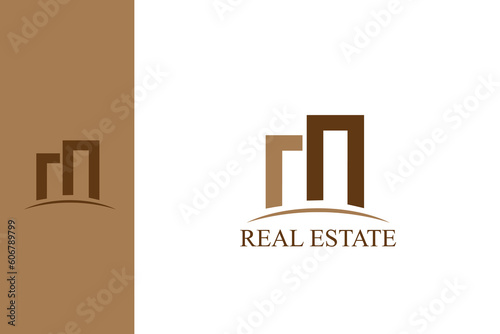 m and n letters building city real estate business logo concept