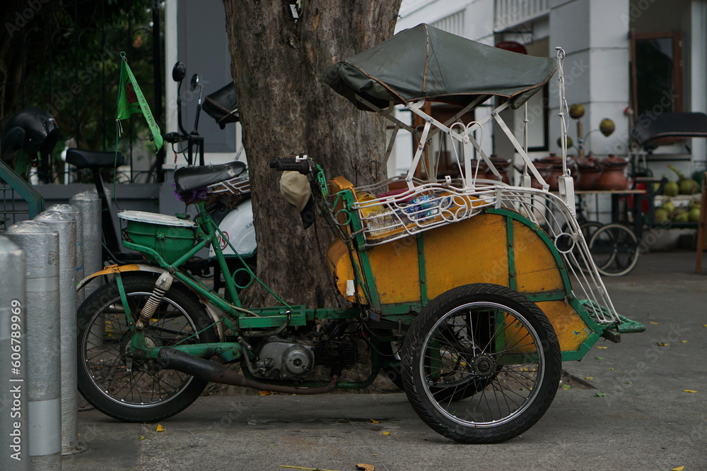 Surakarta, Indonesia -05 May 2023; Becak is a traditional means of transportation, tourist transportation which is still active in the city of Solo.