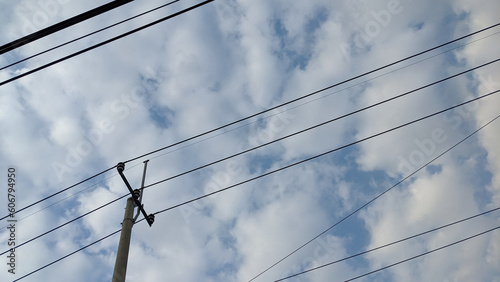 low angle of Electrical poles and resistance transformer in city with clear sky background
