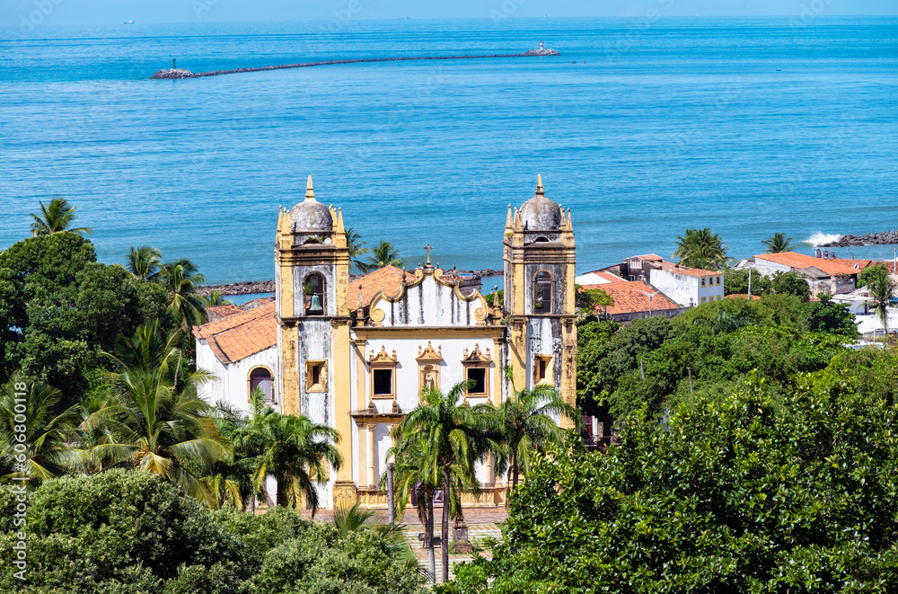 The historic architecture of Olinda in Pernambuco, Brazil showcasing its 17th century buildings on cobblestone streets during the summer on a sunny day.