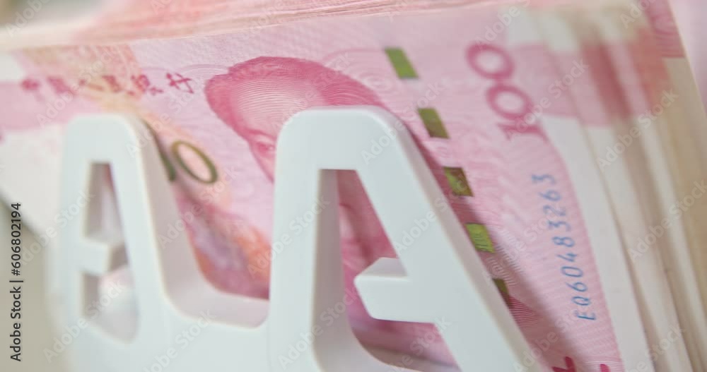 Closeup of electronic or automatic machine for counting bills or money. Banknote or currency counter counts one hundred, 100 CNY Chinese yuan cash, banking and commercial activity, financial concept. Closeup of electronic or automatic machine for counting bills or money. Banknote or currency counter counts one hundred, 100 CNY Chinese yuan cash, banking and commercial activity, financial concept.