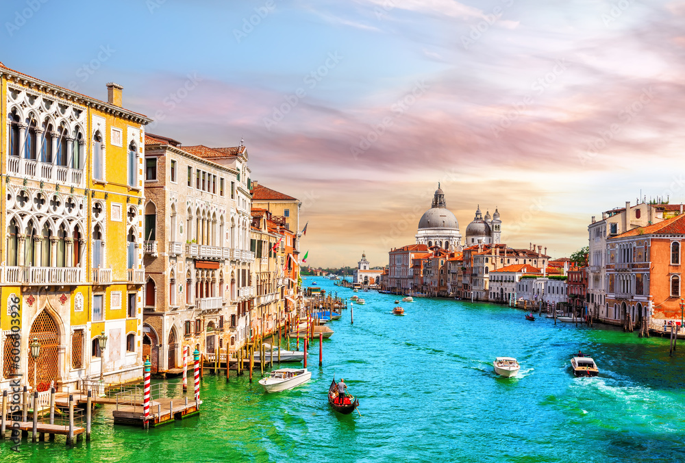 Gondolas and boats in the Grand Canal of Venice near Santa Maria della Salute, Italy