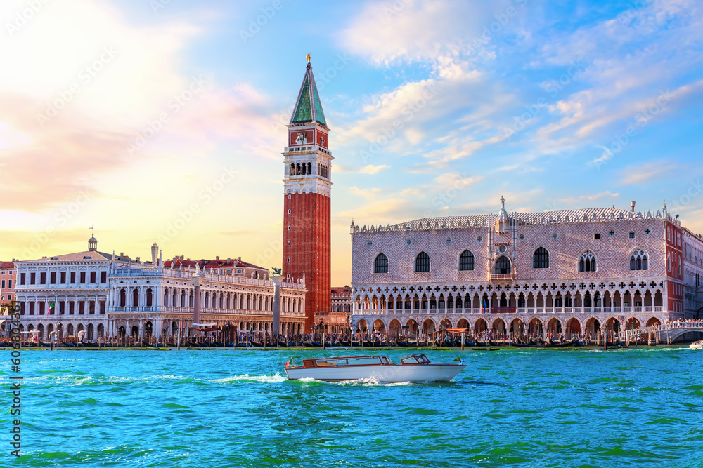 San Marco and Doge's Palace of Venice with many tourists under a sunset sky, Italy