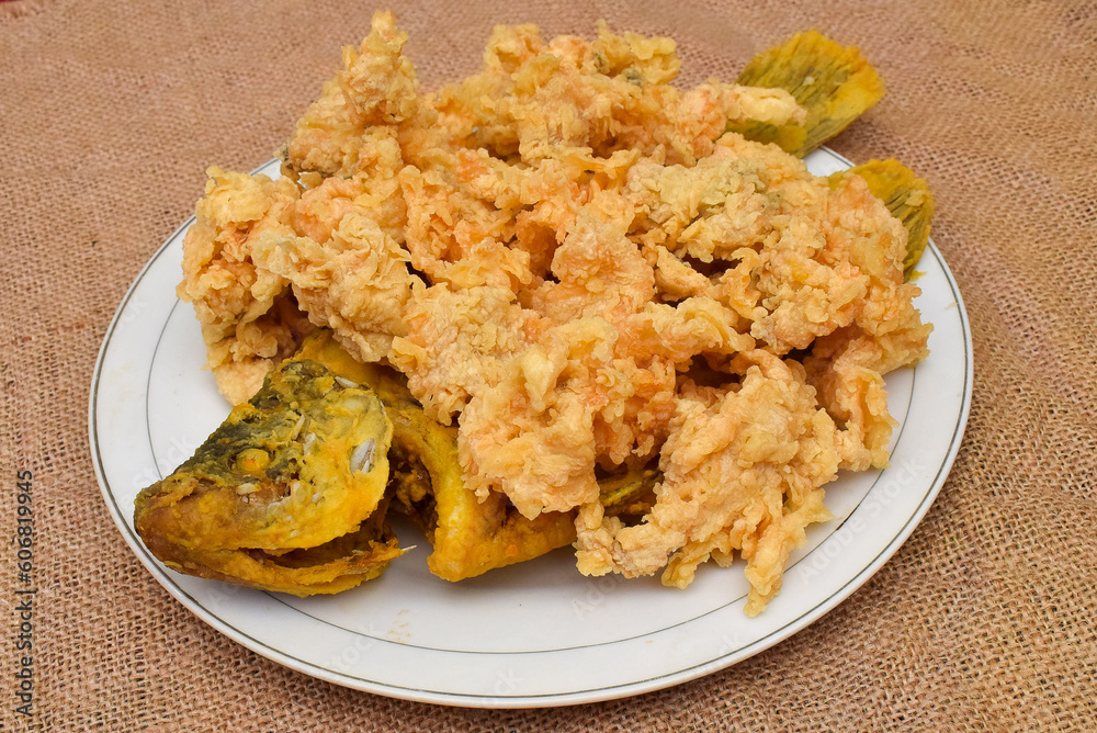 Crispy gurame on the white plate, delicious freshwater fish. processed food. Crispy gurame on the white plate, delicious freshwater fish. processed food.