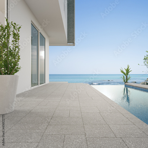 Empty terrace floor and white wall in modern beach house or luxury pool villa. Concrete tile deck 3d rendering with sea view.