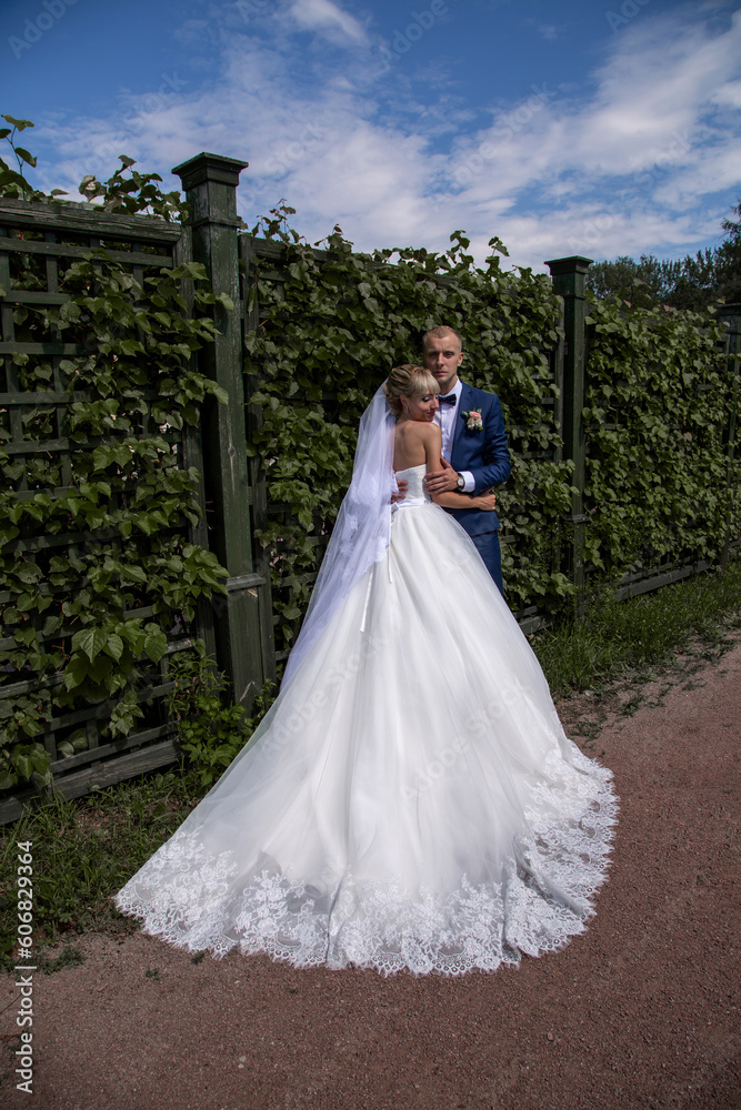 Newlywed couple in love in the park. Summer wedding. Newlywed couple in love in the park. Summer wedding.