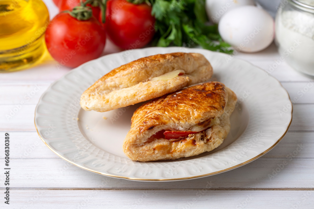 Tomato Cheese Pie. Boyoz with tomato and cheese from traditional Turkish cuisine. Turkish name; domatesli boyoz.