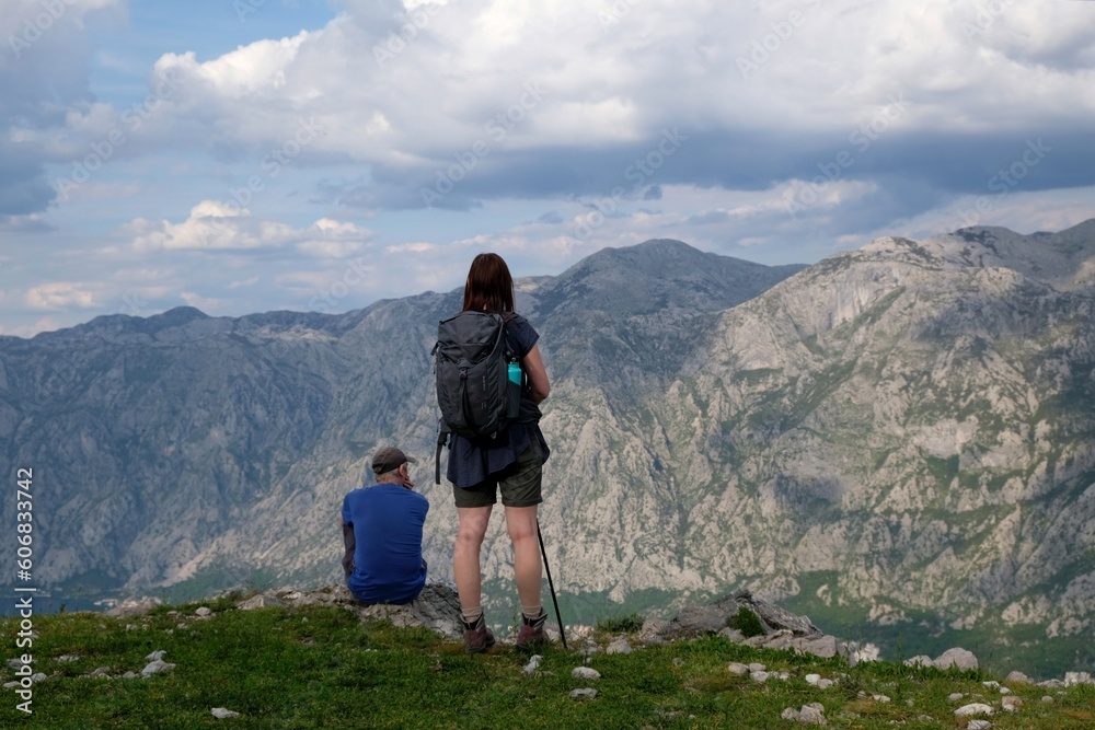 Silhouettes of people on top in mountains. Mountain views on the route from Kotor to the Vrmac Peninsula, with the highest peak Sveti Ilija. Montenegro, Balkans