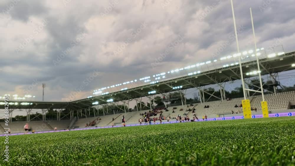 4k clip with turf on rugby stadium. Match and players blurred in background. 4k clip with turf on rugby stadium. Match and players blurred in background.