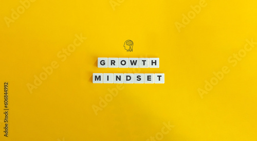 Growth Mindset Phrase on Block Letter Tiles on Yellow Background. Minimal Aesthetics.