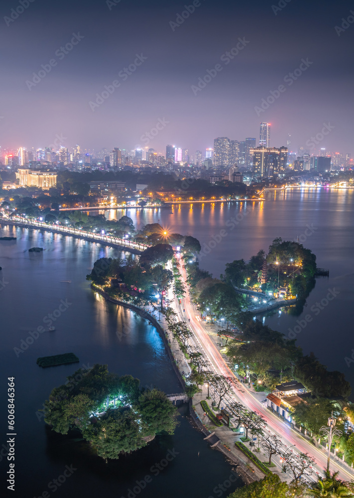 Aerial view of Hanoi skyline cityscape near Thanh Nien street and Tran Quoc pagoda at night. Famous destination of Vietnam