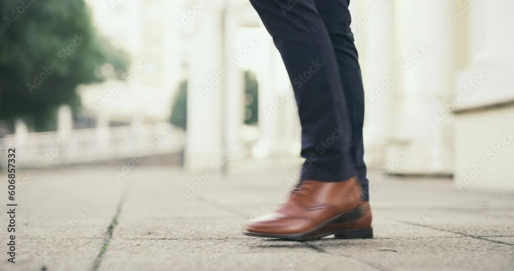 Travel, walking and shoes of business man in city for morning, professional and commute to work. Traveling, corporate and feet of confident male entrepreneur on ground by office building for career Travel, walking and shoes of business man in city for morning, professional and commute to work. Traveling, corporate and feet of confident male entrepreneur on ground by office building for career