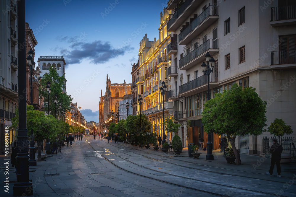 Avenida de la Constitucion Street at Sunset with Seville Cathedral - Seville, Andalusia, Spain