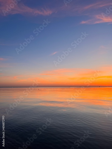 Orange sky after the sunset at the sea  evening sea horizon 