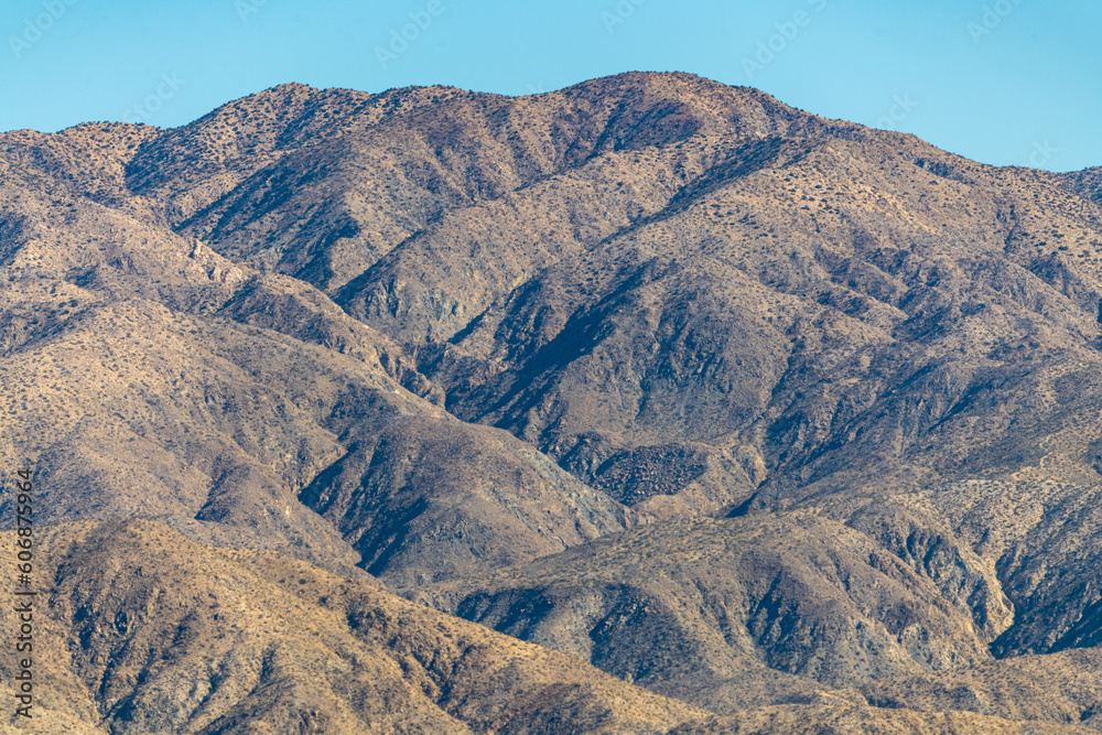 Φωτογραφία The valley of Palm Springs landscape in fall on a hazy, warm afternoon from aerial, above shot, blue sky background in the California desert