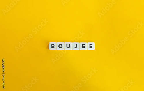 Boujee - popular Slang Word on Block Letter Tiles on Yellow Background. Minimal Aesthetics.