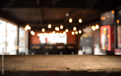 Empty wooden table and blurred cafe background, product display