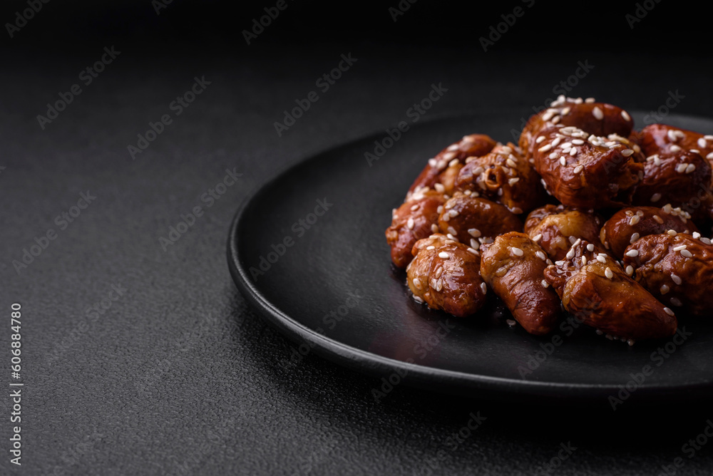 Chicken hearts fried in soy sauce with salt and spices in a plate Chicken hearts fried in soy sauce with salt and spices in a plate