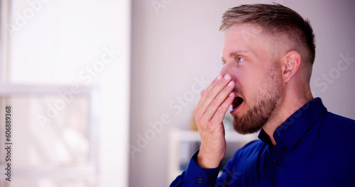Bad Smell Dental Breath And Hand Near Mouth
