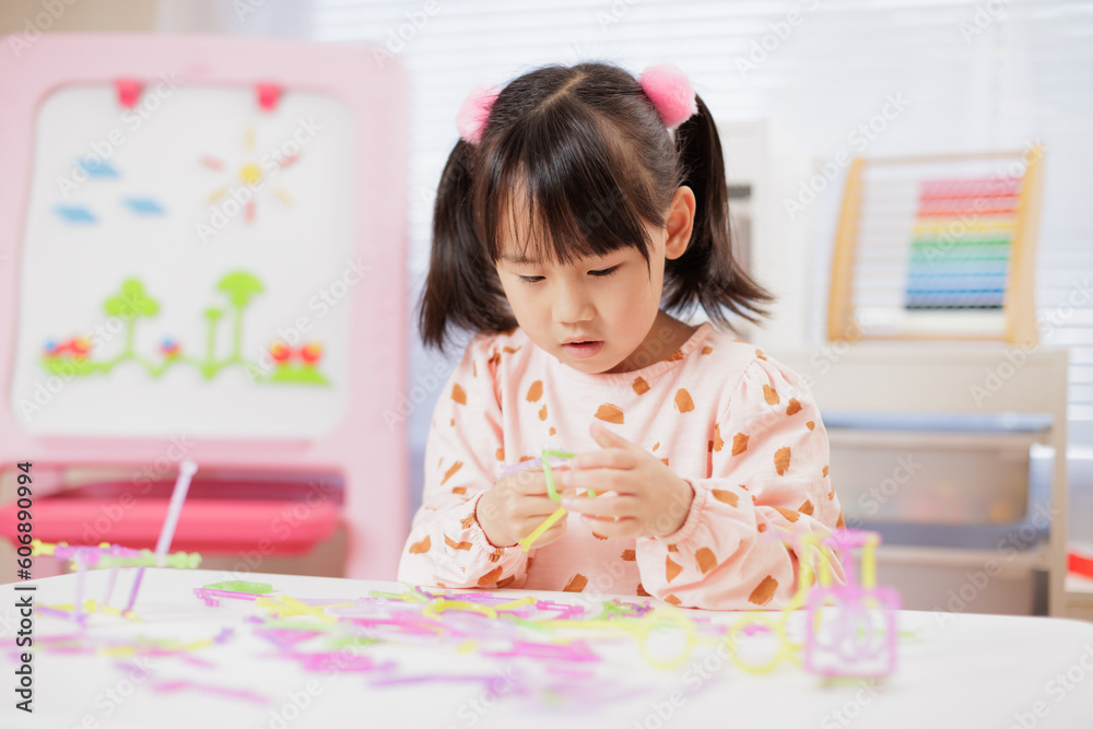 young girl was playing creative toys at home young girl was playing creative toys at home