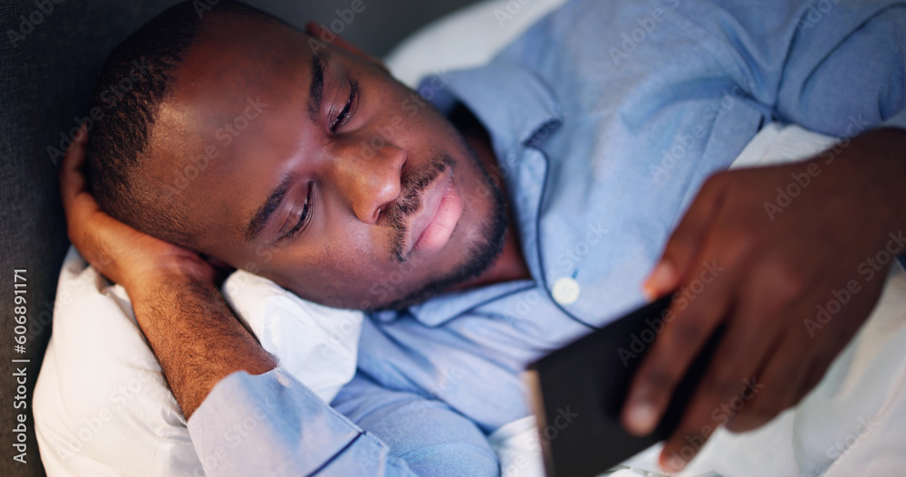 Obraz premium Watching Cell Phone Before Sleep At Night